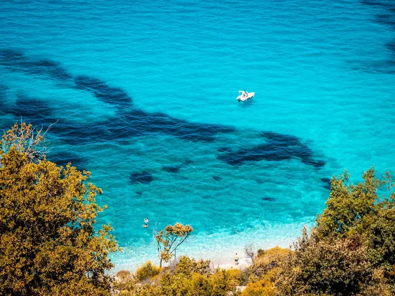 Boats in the turquoise water near Ksamil